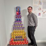 Jimmy next to a tower of easter eggs